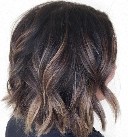 Sun kissed balayage on dark brown hair