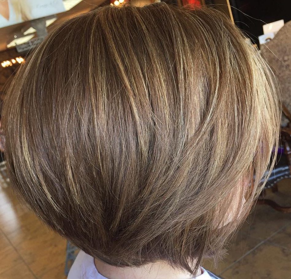 Sun kissed dark blonde hair with highlights for short hair