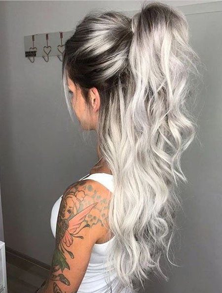 Short silver hair with dark roots