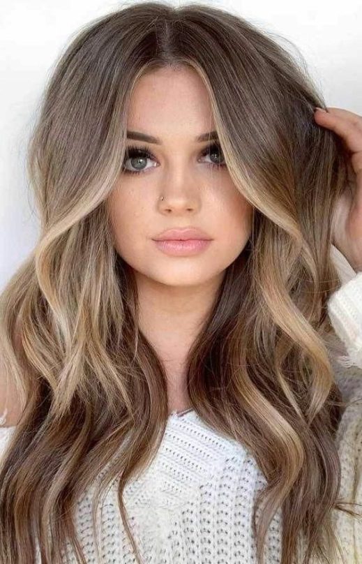 natural curly brown hair with blonde highlights