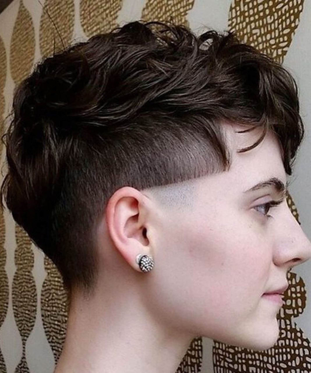 Women’s modern bowl cut featuring faded sides and soft layers